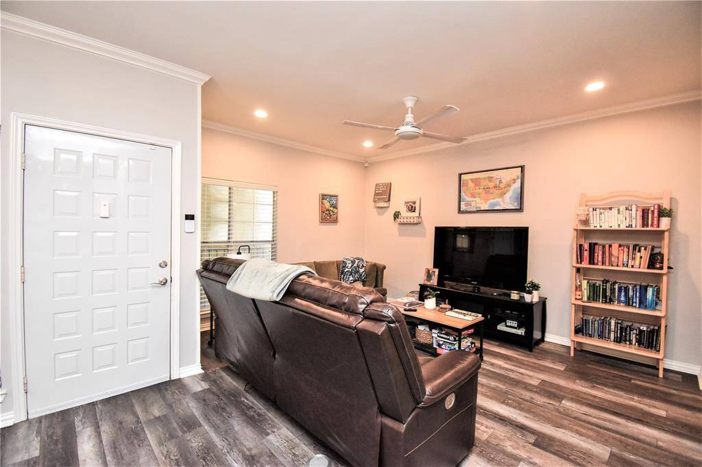 Wood flooring and clean white walls with cozy tone of warm lights, perfect for fun and relaxation