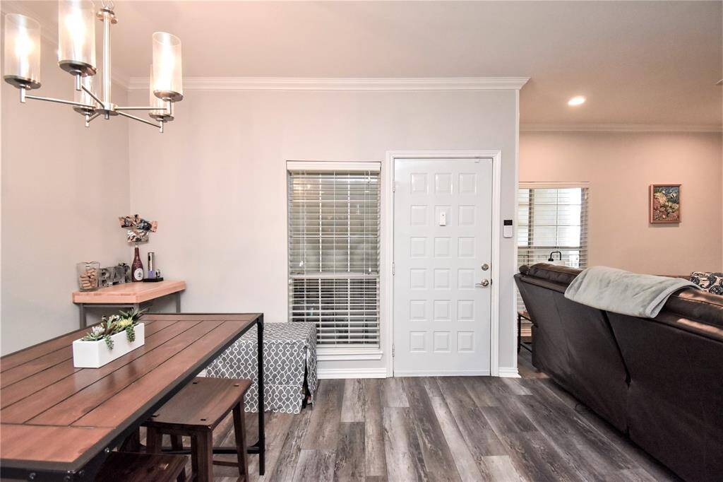 A welcoming entryway that opens up to a a good view of the whole room, from living area, dining and kitchen