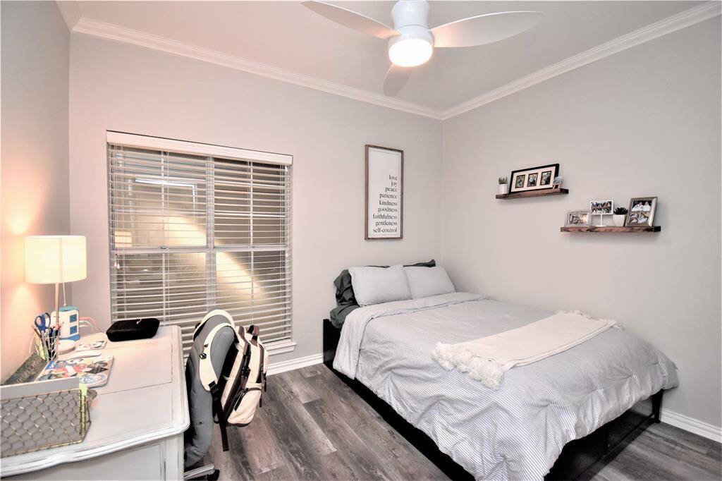 Bedroom with study table and adequate space for a tidy set-up, perfect for students