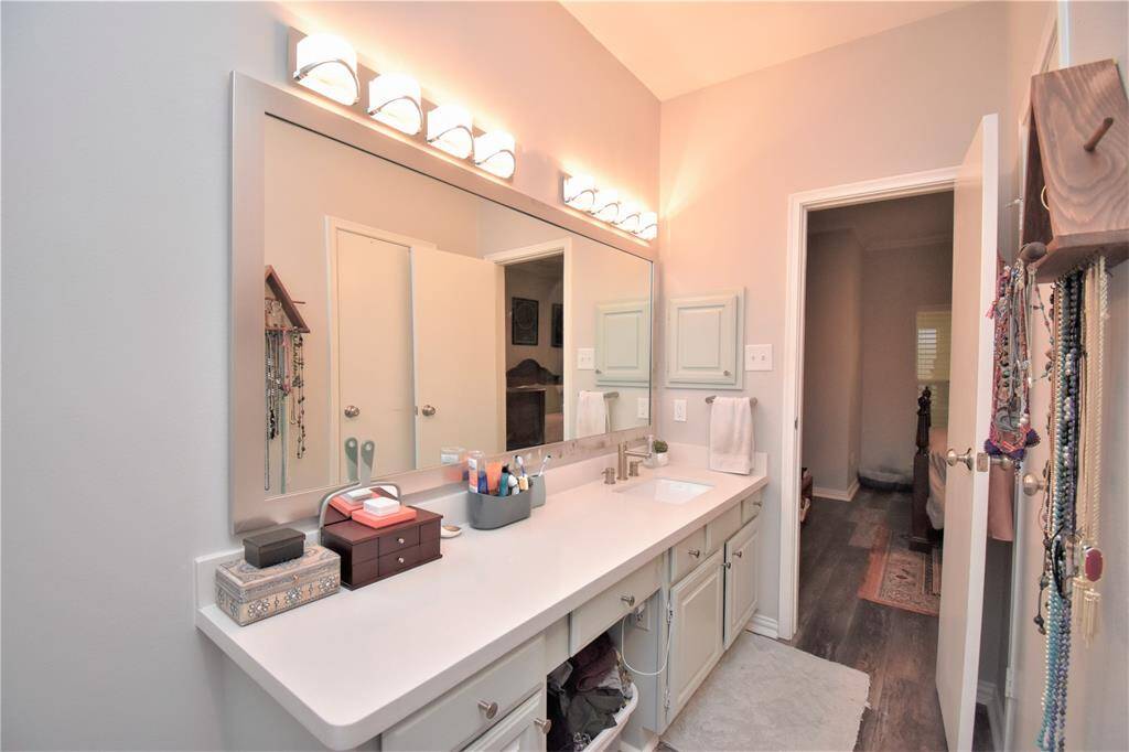 Just like the other bathroom this has a wide length mirror with wall mounted lights that's perfect for vanity. It also has an adequate cabinet spaces for personal stuff.