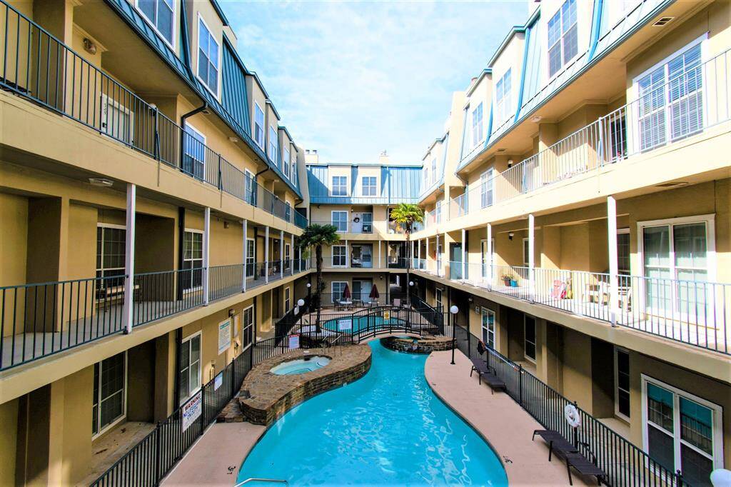Overview of the whole building with its beautiful pool at the center