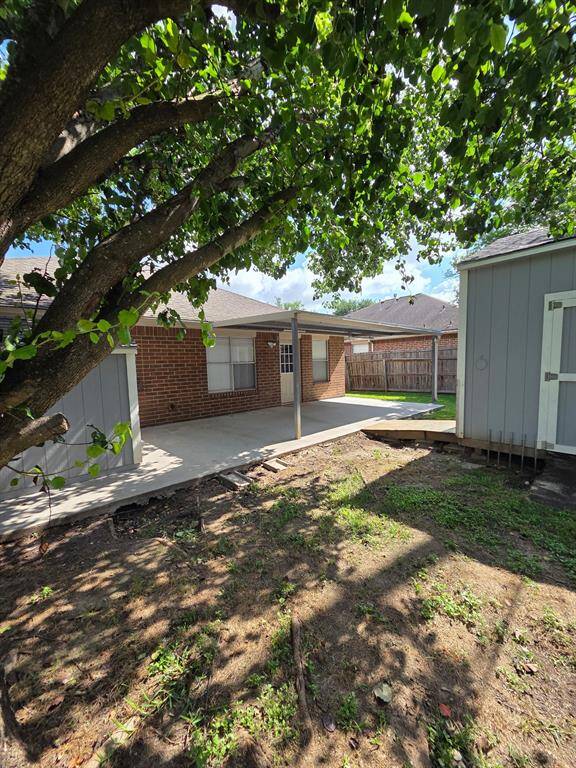 large covered patio and two storage buildings, one is 12x12 with full insulation and ac. The small one has electrical and ac also.