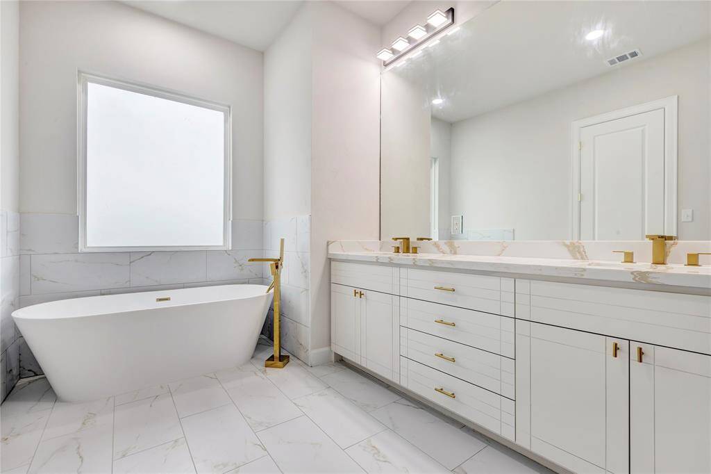 The luxurious freestanding tub is perfect for relaxation.