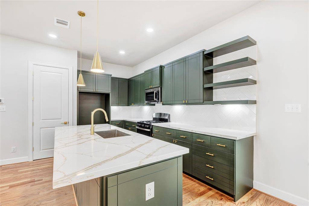 The kitchen provides ample storage space and counter space.