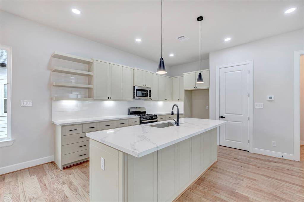 The kitchen provides ample storage space and counter space.