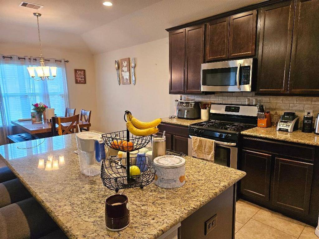 Kitchen with Island & Granite Counters.