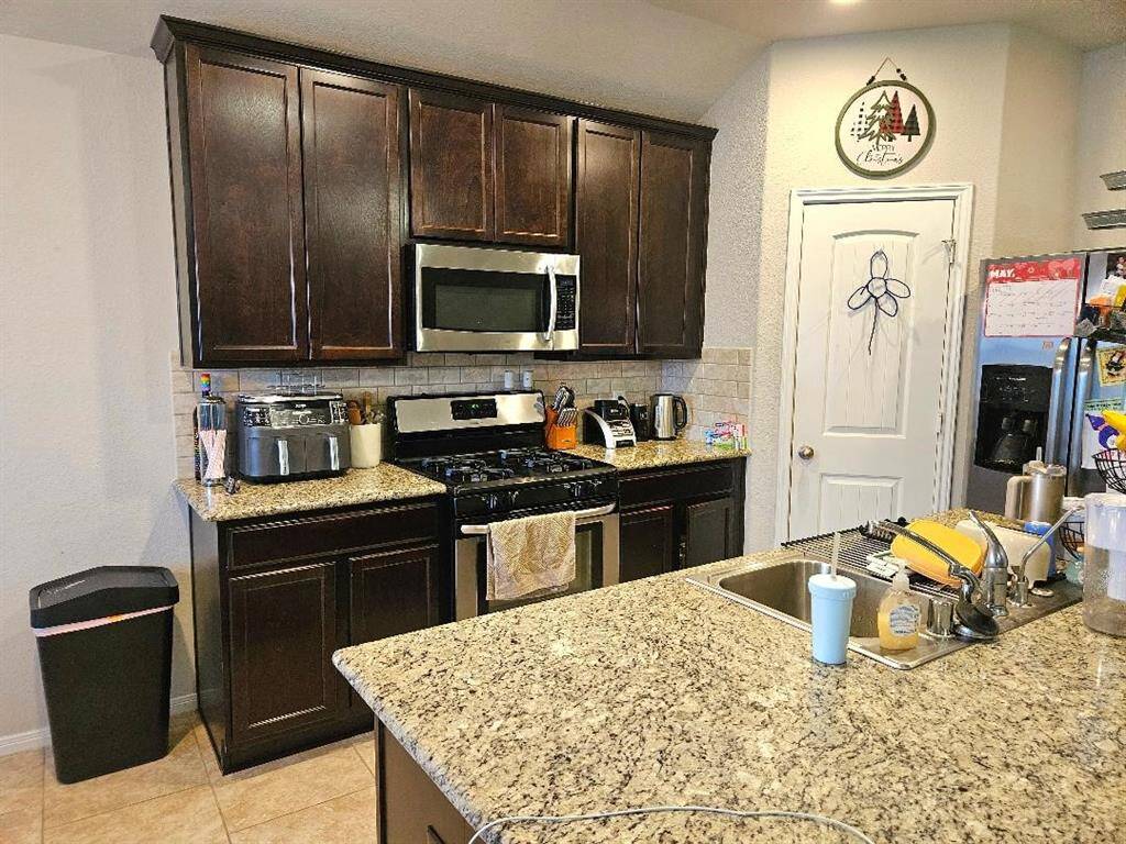 Another view of Kitchen with Lots of Cabinet Space. FRIDGE STAYS.