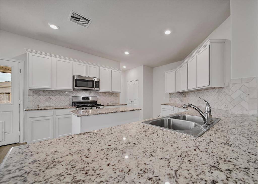 So Much Storage and Counter Space! The Center Island is a Wonderful Addition to any Kitchen.