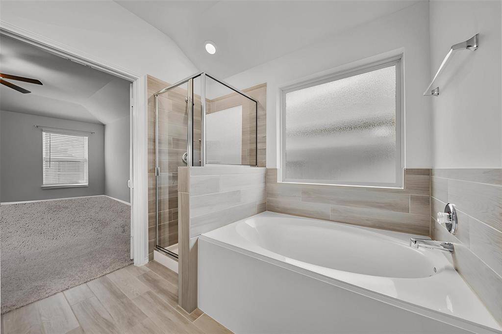 The Lengthy Double Sink Vanity has Lots of Space and the Cabinets Offer Lots Of Storage. The 2 Doors Provide Access to the 2nd Closet and the Private Potty Room.