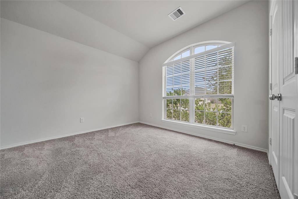 The Laundry Room Is Nice Sized with a Built-In Hanging Rack and a Window to the Backyard. It Also Offers Extra Space for a Work Table. And, the Washer and Dryer (not shown) are Included !