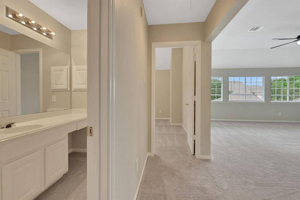 Secondary bath upstairs, conveniently located next to the gameroom and bedroom.