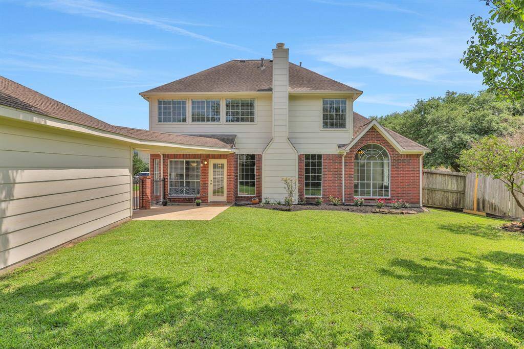Beautiful backyard featuring lush landscaping, creating a serene and inviting outdoor space.