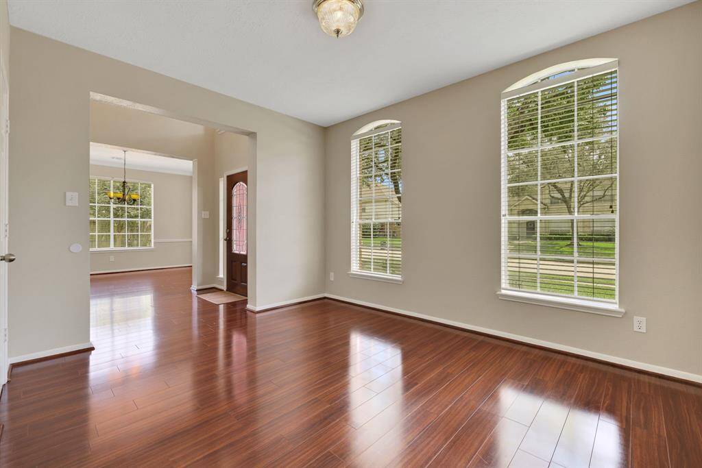 Spacious home office located just off the entryway, offering the perfect setting for productivity and style.