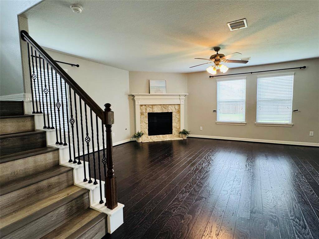 Wood floors on stairs, hallway and playroom.