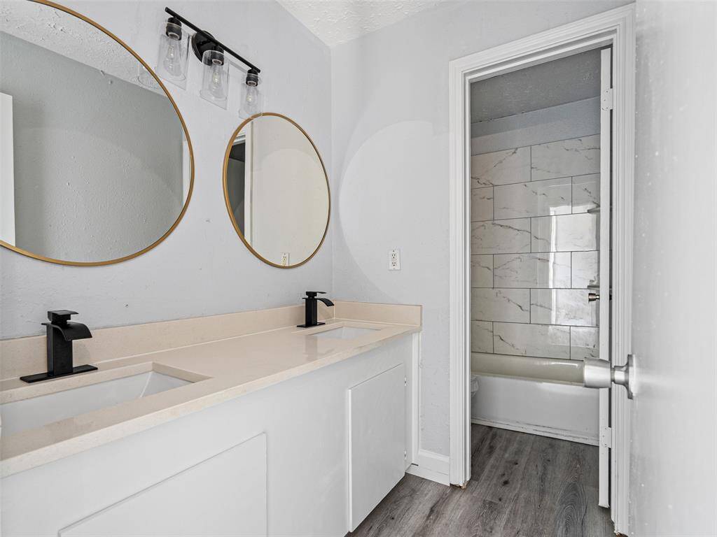 Stylish bathroom with a spacious double sink vanity and fresh finishes for a clean, contemporary feel.