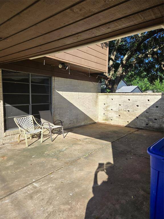 Back patio btwn house & garage view 2