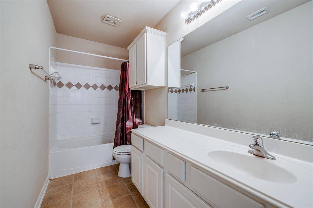 One of two full baths located upstairs.