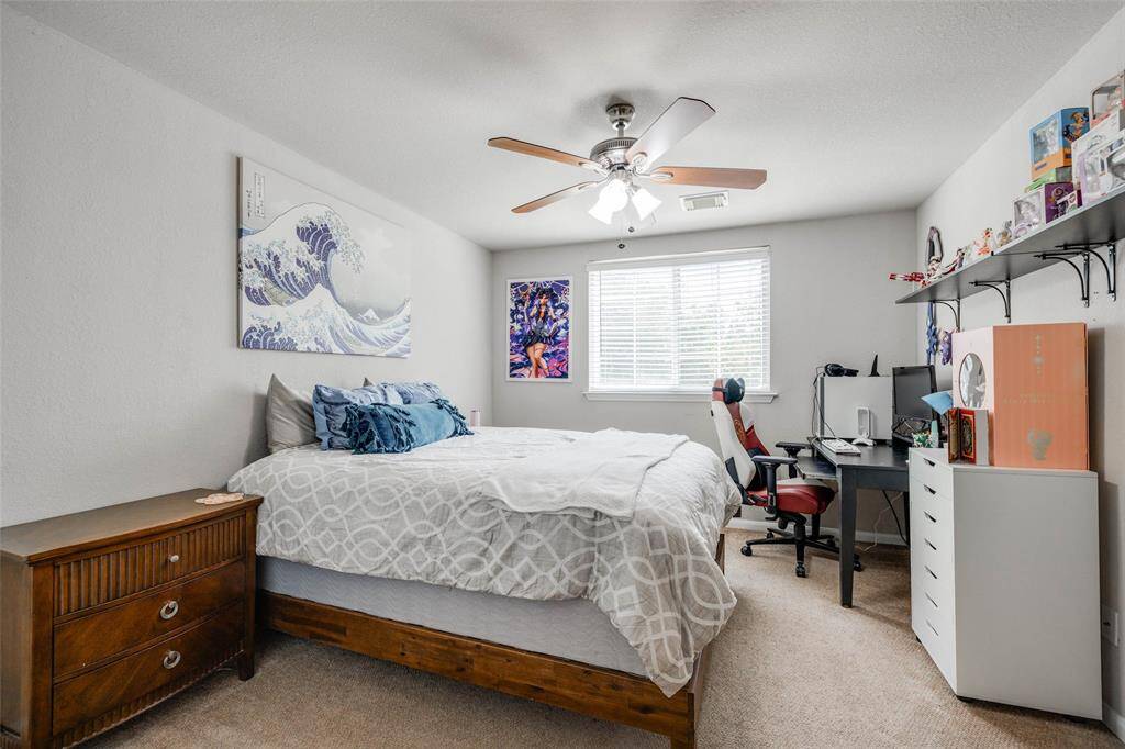 Bedroom 2 with Carpet has been replaced with laminate wood flooring , ceiling fan, 2 in blinds & closet