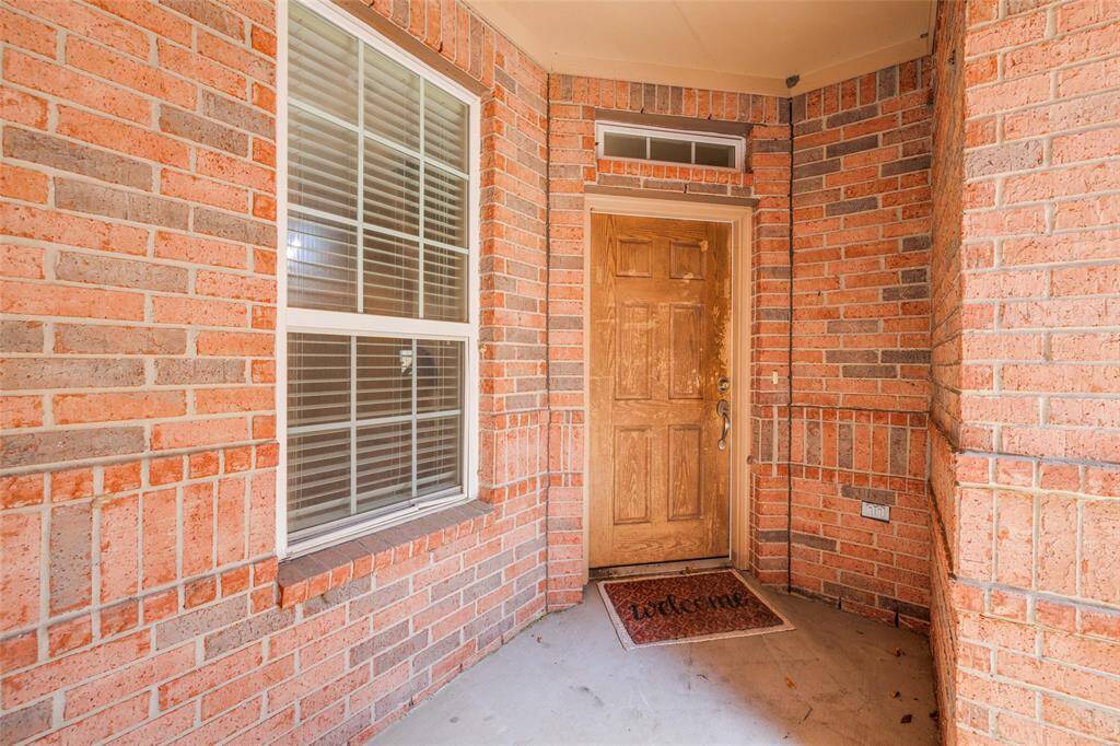 Private entrance into this lovely home with covered area at front door.