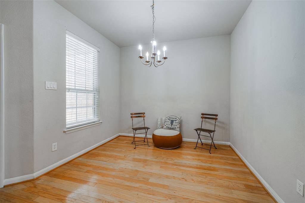 Wood floors as you enter into this Townhome with formal dining area, chandelier, 2 inch blinds