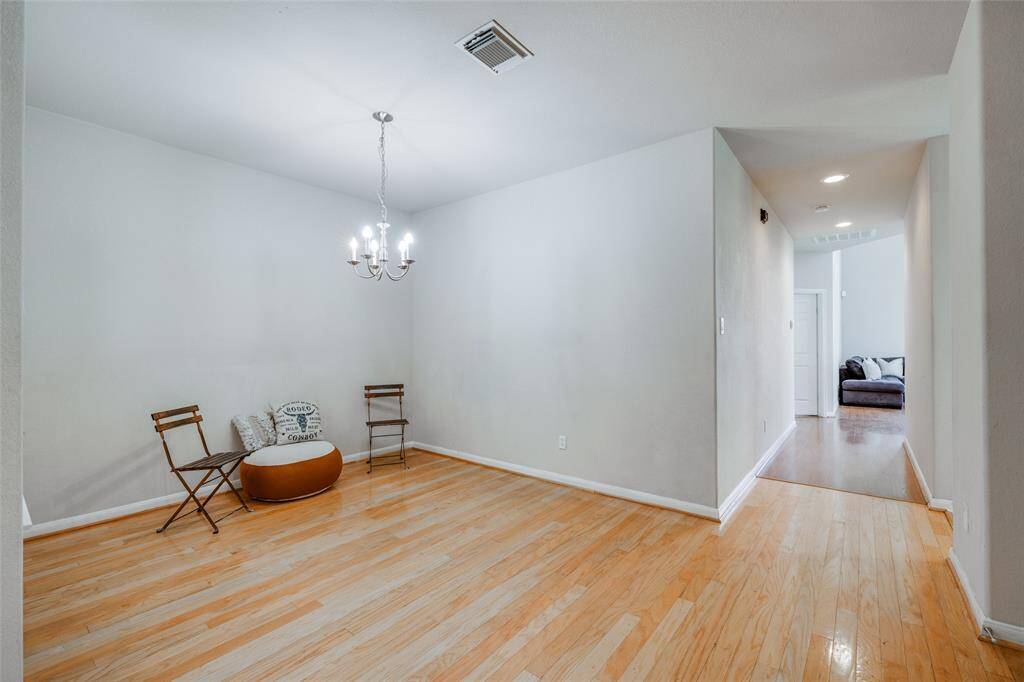 Wood floors as you enter into this Townhome with formal dining area, chandelier through to kitchen & living room