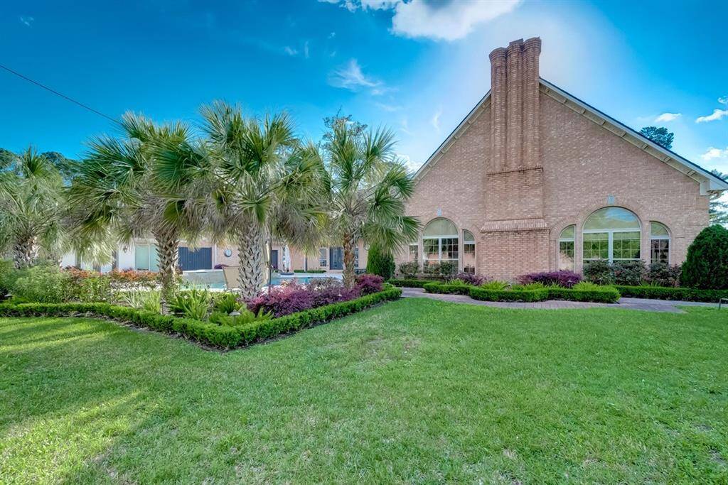 Experience a tranquil oasis with lush landscaping in this stunning backyard retreat.