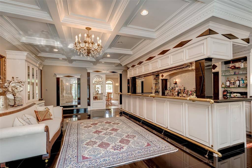 Luxurious bar and cozy sitting area adjacent to the dining room, perfect for entertaining.