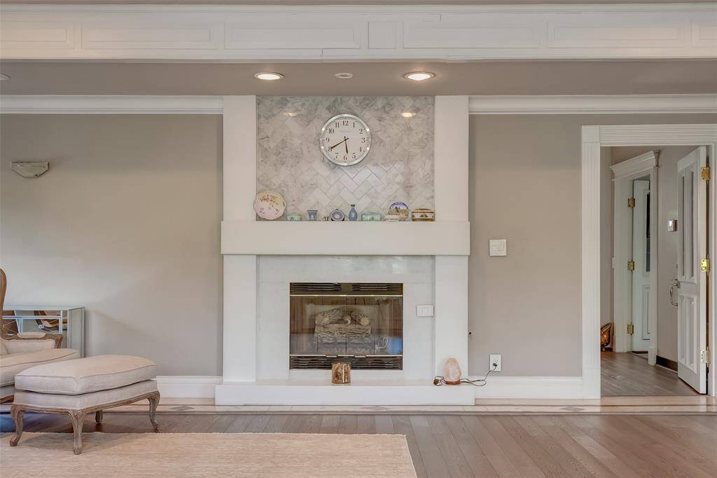 Cozy master bedroom featuring an elegant fireplace, perfect for relaxing evenings.