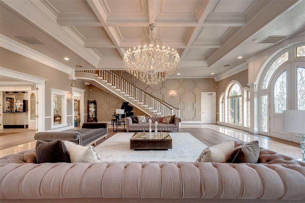Luxurious Restoration Hardware furniture in the grand room is available for the new owner.