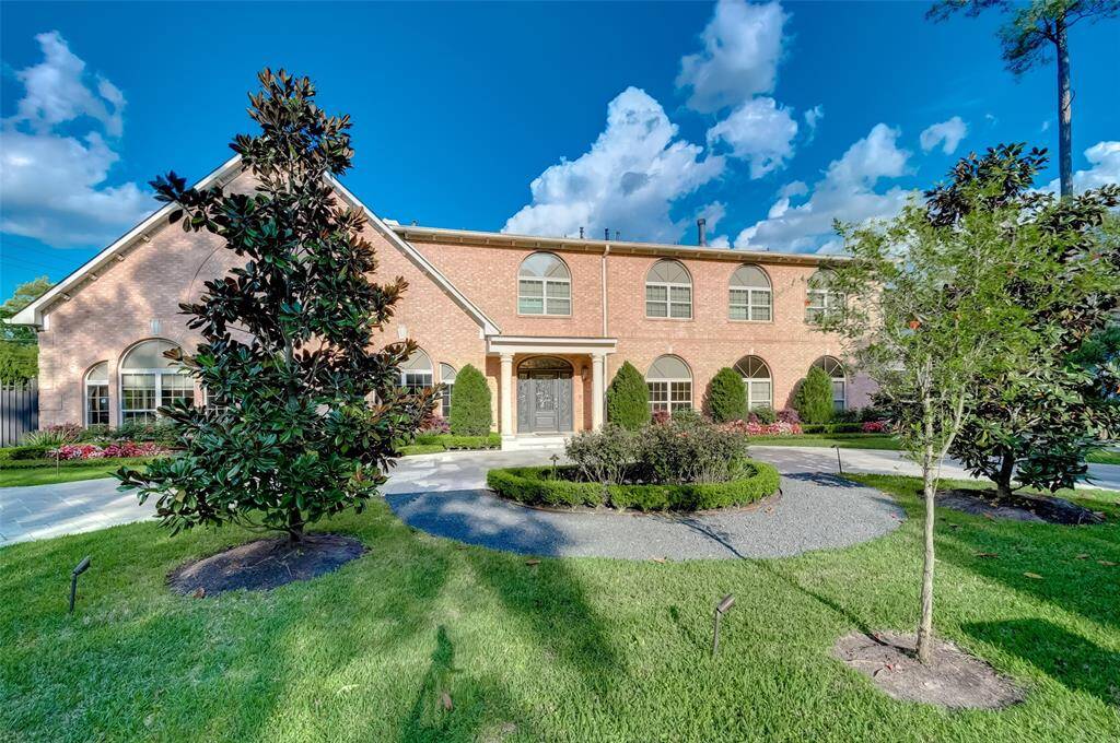Charming magnolia tree graces the front yard, enhancing curb appeal.