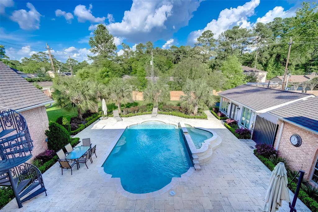 Enjoy stunning pool views from the upstairs balcony.