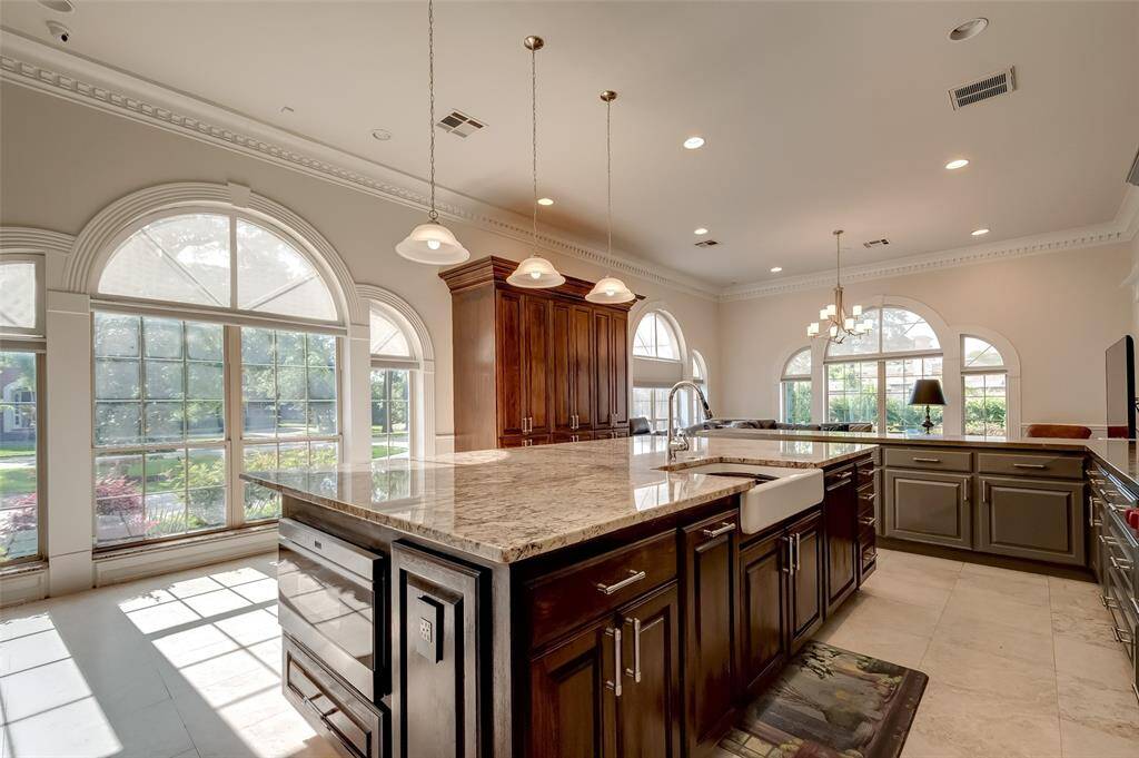 Luxurious kitchen island featuring exquisite Italian granite countertops.