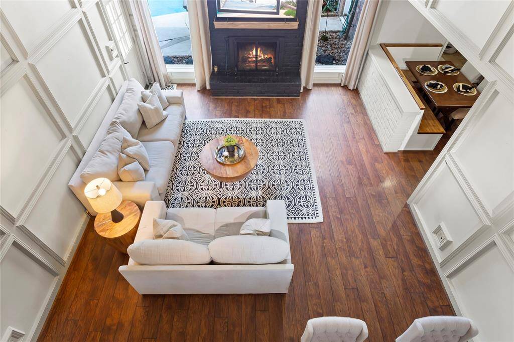 Looking from the second floor game room down to the family room. The Breakfast area is to the right