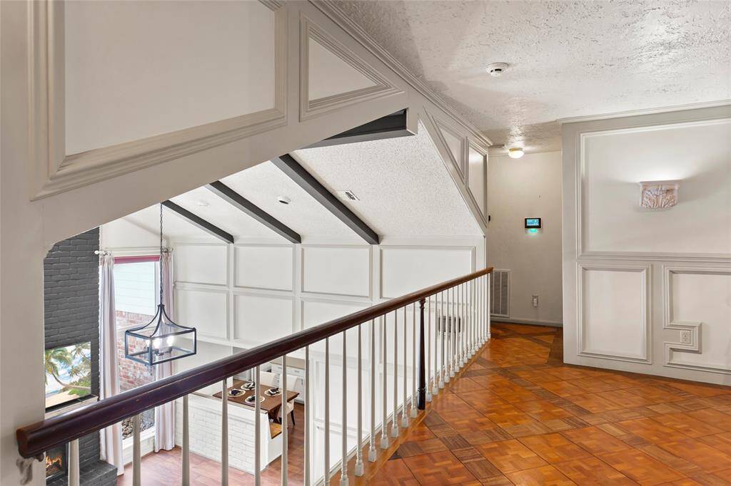 View from game room looking towards two of the four secondary bedrooms