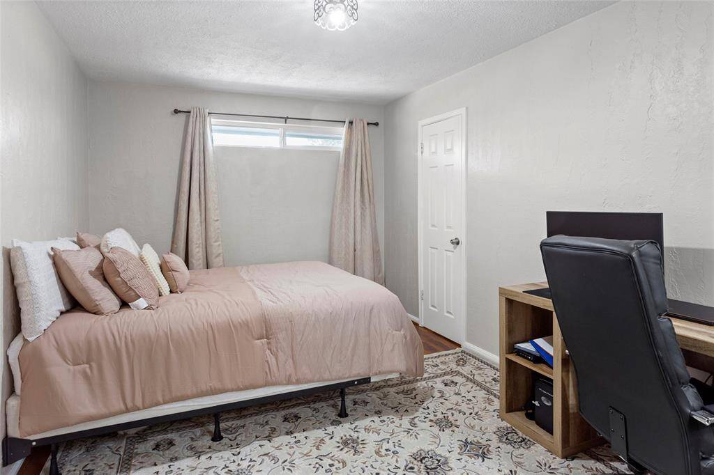 Secondary bedroom number four of four. This room would be perfect for a dedicated office area.