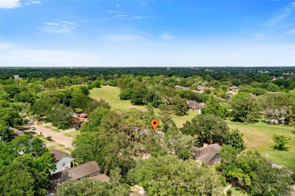 Overhead view. Notice the large greenspace that runs behind the home and property