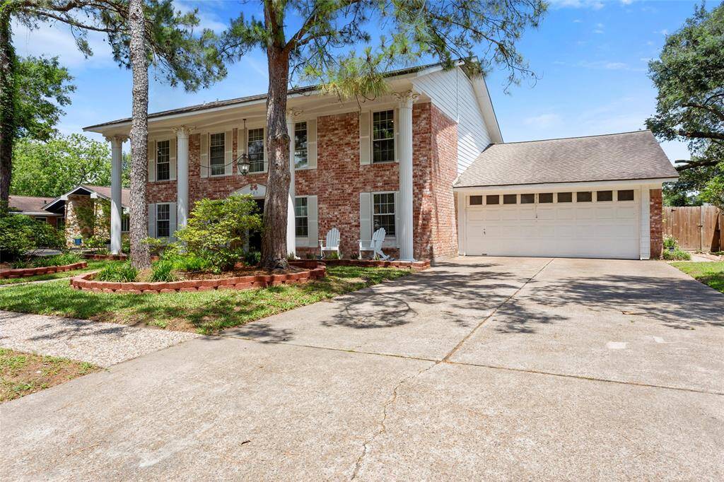 Beautiful home on a tree lines street with a 4 car garage
