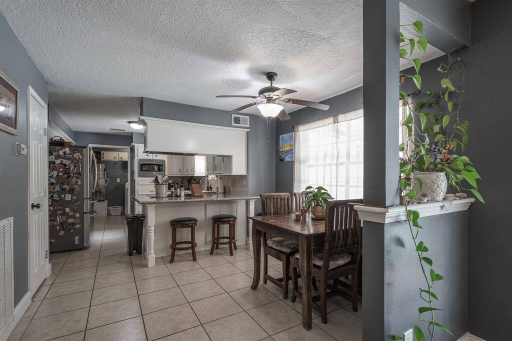 Breakfast area and kitchen with tons of storage.