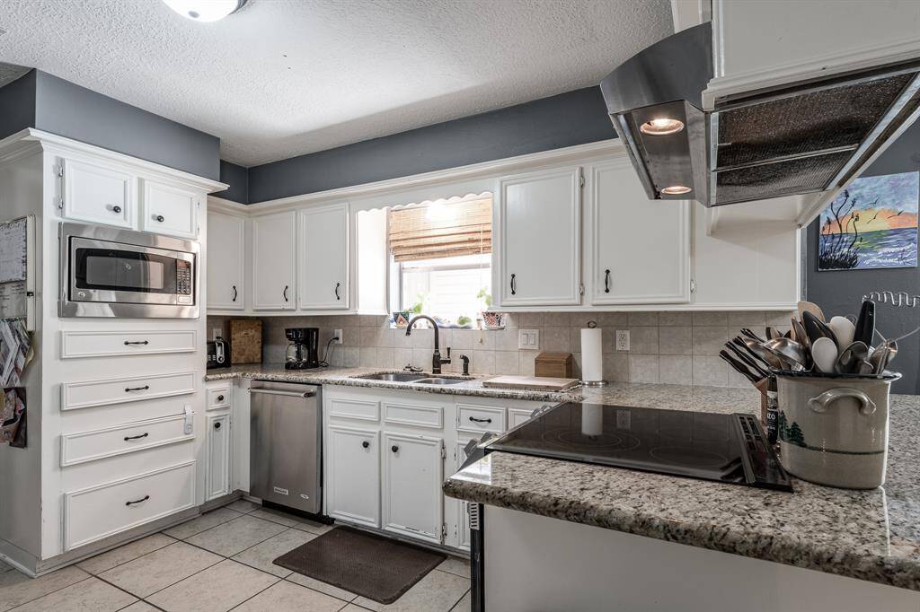 Kitchen with stainless steel appliances.