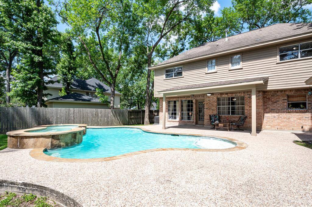 Take a break from the Houston summer, under this covered patio and take a dip in this 2015 inground pool.