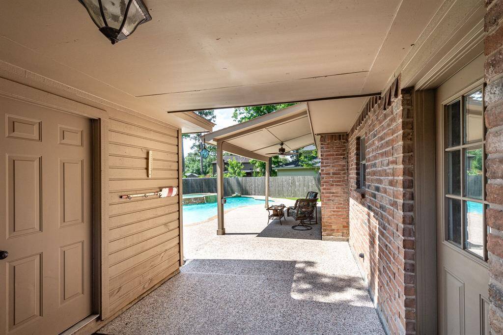 Detached garage with a view of the pool.