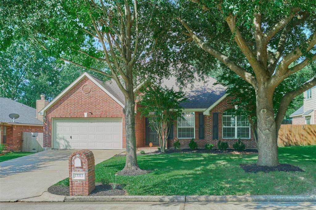 Beautiful 3 bedroom home with a study/home office on a premier lot in Walden on Lake Conroe.  Just look at these mature trees that grace your front yard.