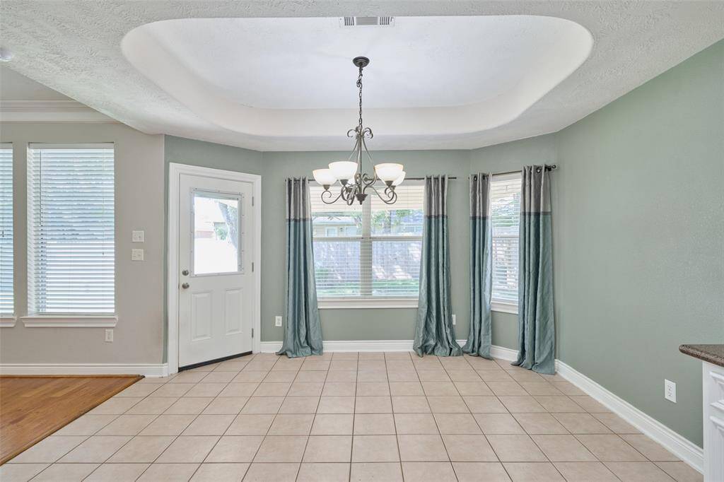 Great dining room if off the kitchen & looks out into the fenced backyard.
