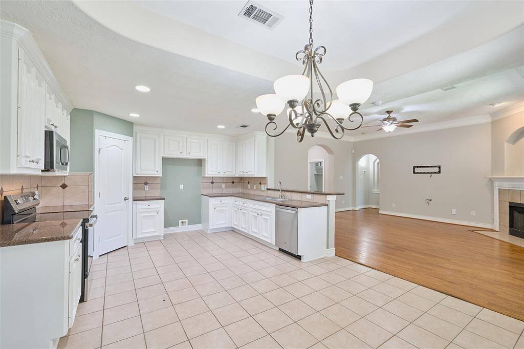 Photo showicasing kitchen looking into living room