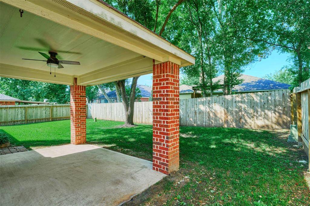 Enjoy the backyard year round under cover of the back patio.  Great yard for kids and dogs & great place to entertain.