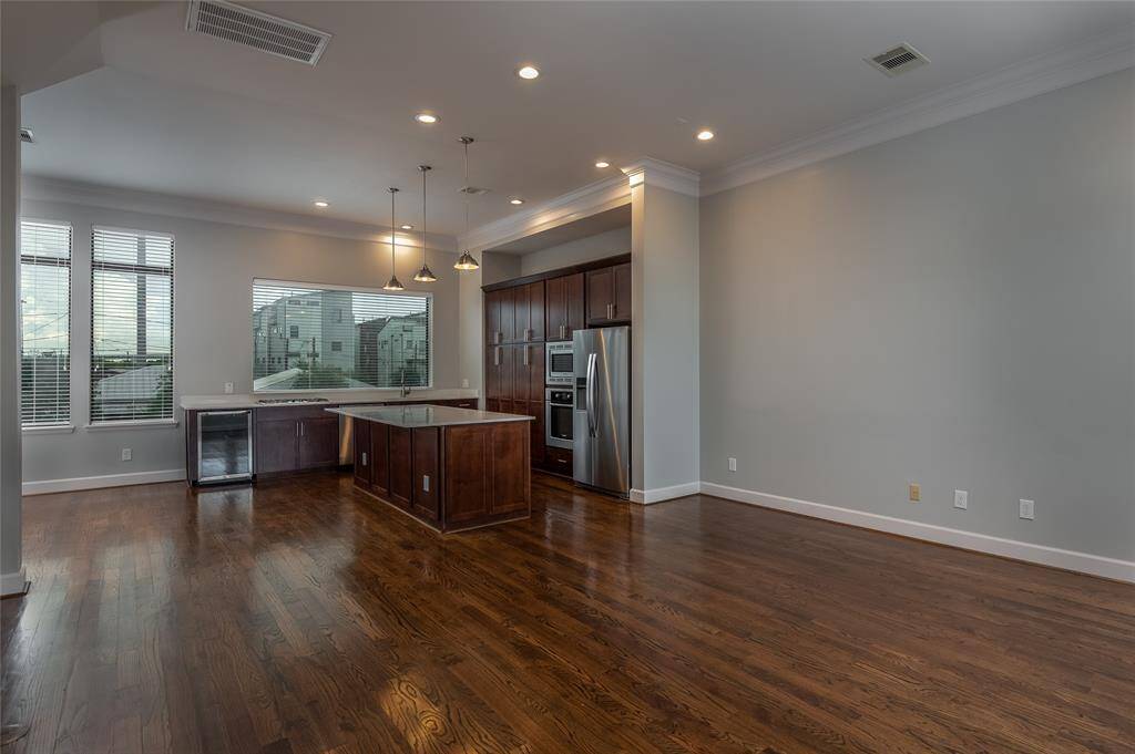 Second floor kitchen, living, dining and half bath.