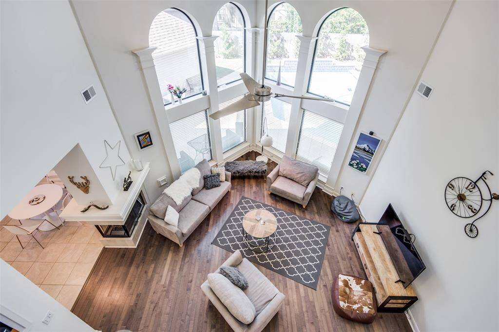 Bird's eye view of the two story family room! Tastefully remodeled, very bright and open floor plan! Pictured on the left is the breakfast room that opens up to the kitchen.