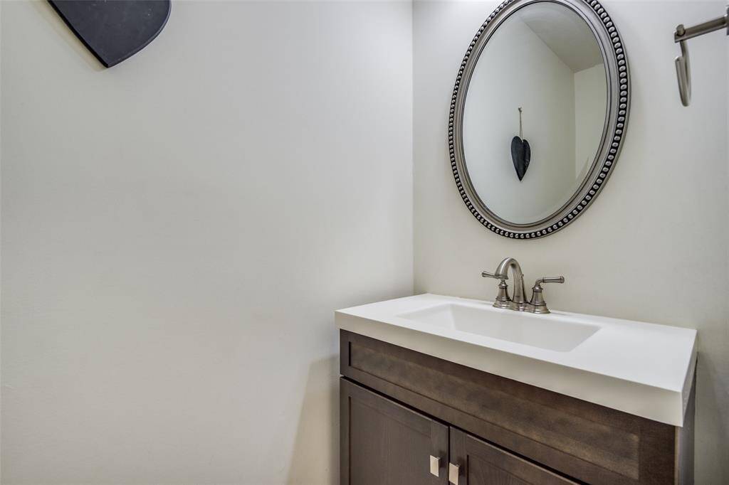 Immediately to the right of the foyer you will find the powder room.