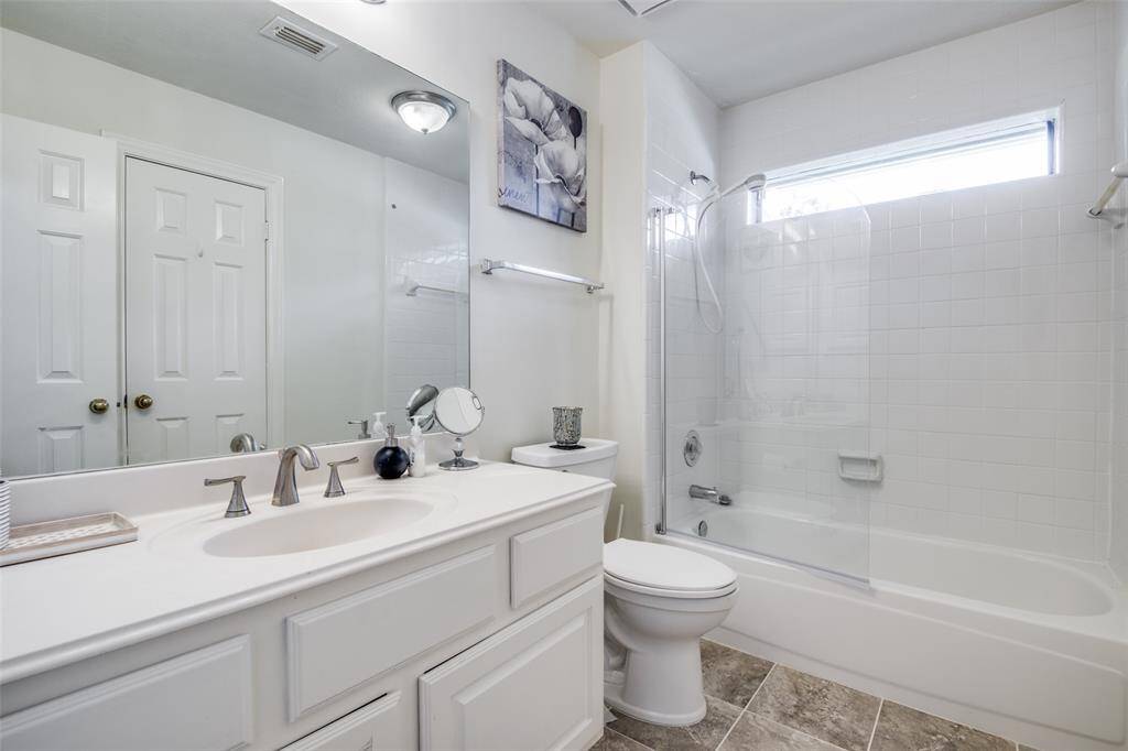 Bathroom No. 2 right off of bedroom no. 2 and the hallway leading into the game room.