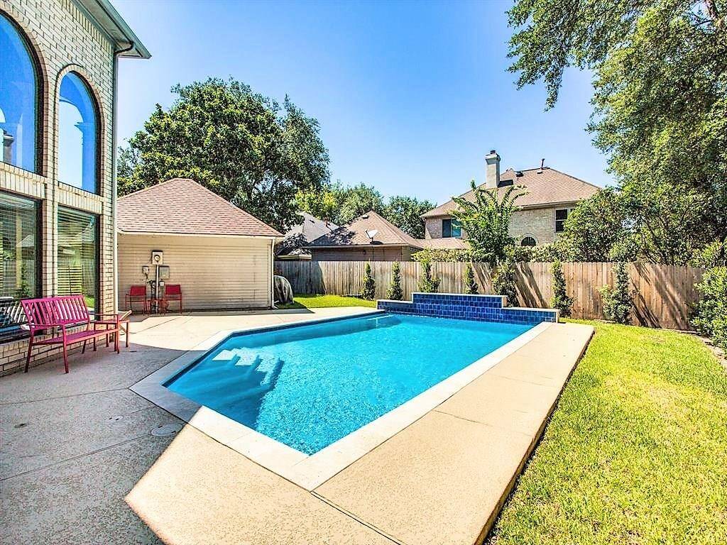 Welcome home to 14202 Scarborough Fair. This backyard oasis is perfect for kicking back and cooling off!